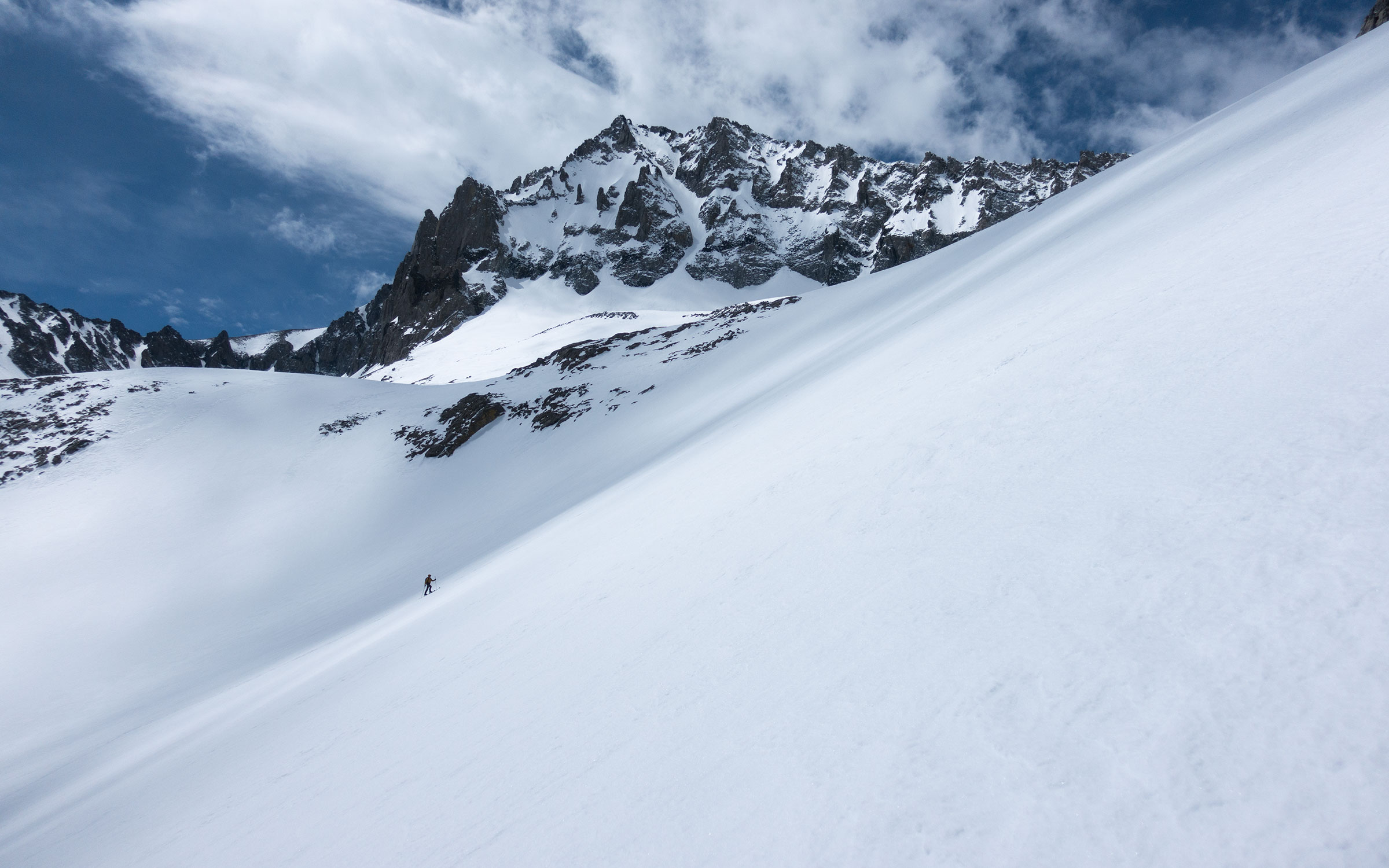 Skier ascending above Birch Lake