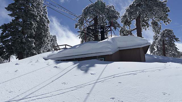 snow-buried hut at Mount Waterman, CA